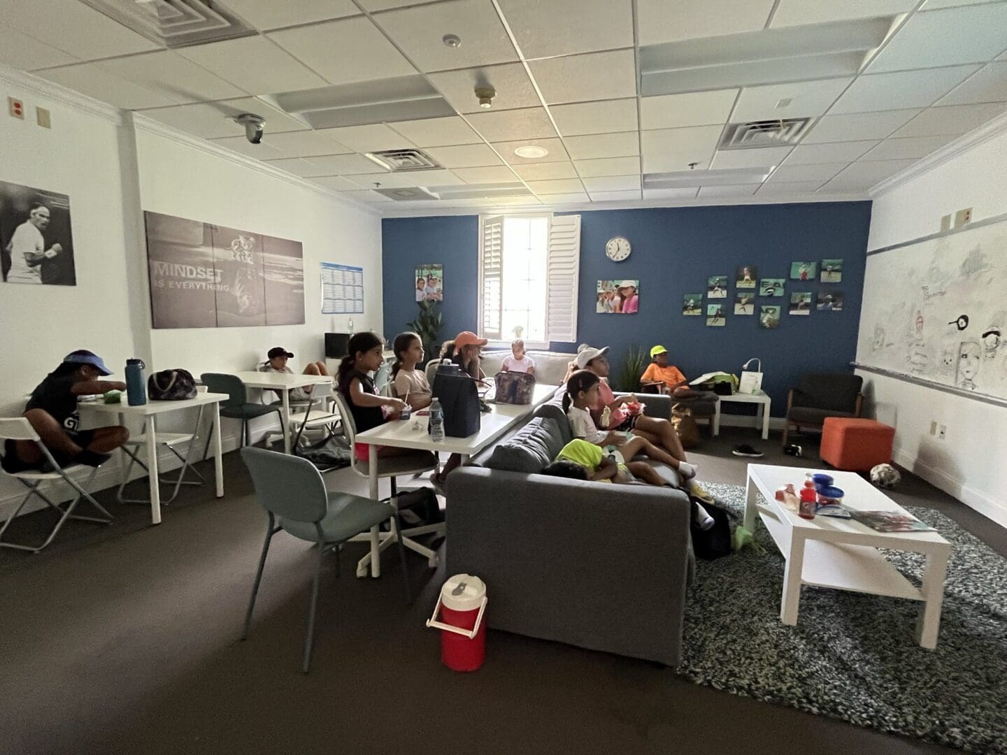 Students studying and working together in a cozy classroom setting.