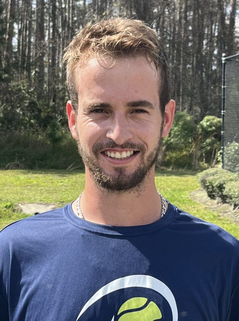 Smiling man outdoors in casual wear.