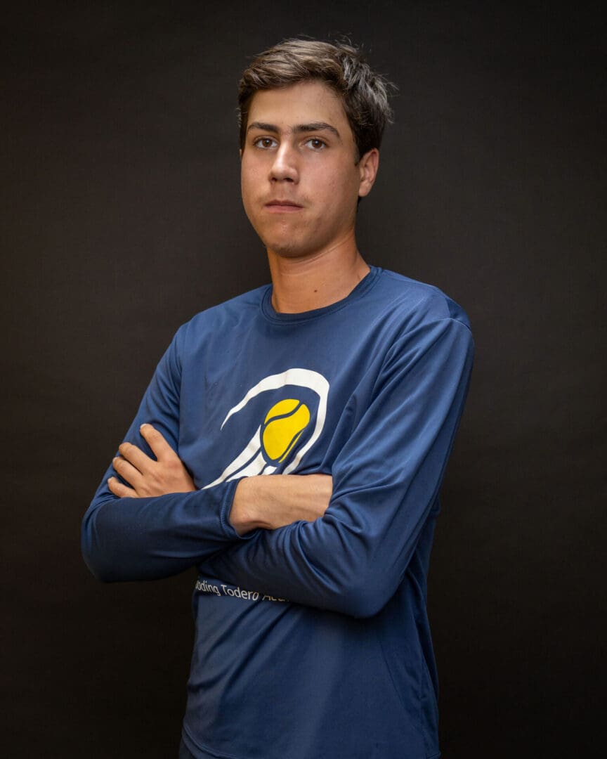 Teen male portrait wearing blue tennis shirt